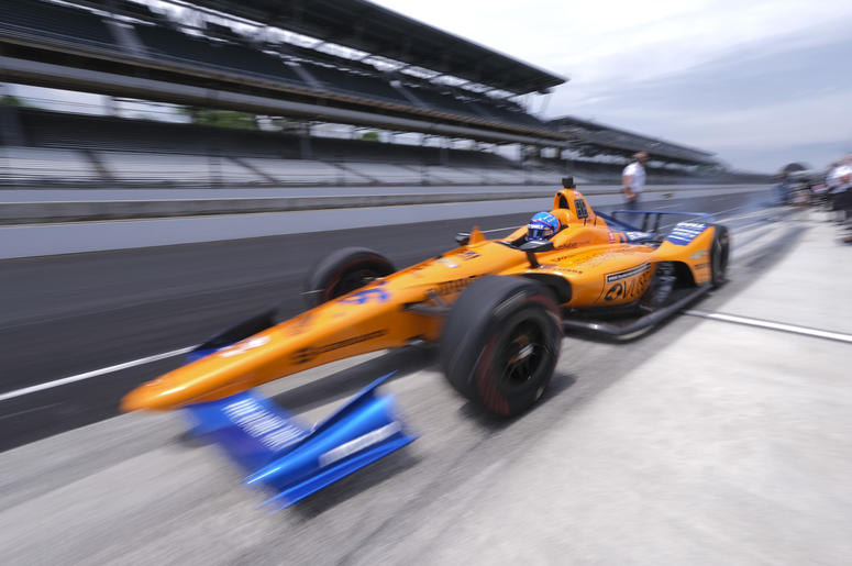 AP19137657392383 Fernando Alonso, of Spain, drives out of the pit area during practice for the Indianapolis 500 IndyCar auto race at Indianapolis Motor Speedway, Friday, May 17, 2019 in Indianapolis. (AP Photo/AJ Mast)