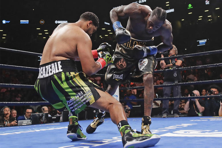AP19139122931955 Deontay Wilder, right, knocks down Dominic Breazeale during the first round of the WBC heavyweight championship boxing match Saturday, May 18, 2019, in New York. Wilder stopped Breazeale in the first round. (AP Photo/Frank Franklin II)