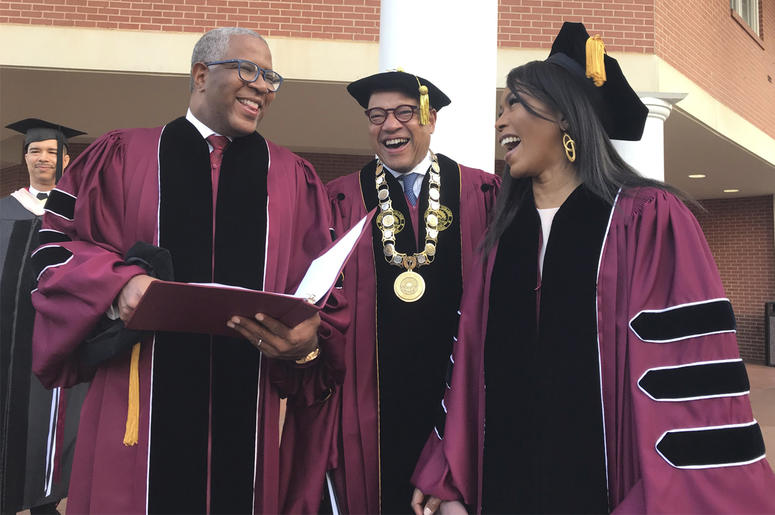 AP19139618471189 Robert F. Smith, left, laughs with David Thomas, center, and actress Angela Bassett at Morehouse College on Sunday, May 19, 2019, in Atlanta. (Bo Emerson/Atlanta Journal-Constitution via AP)