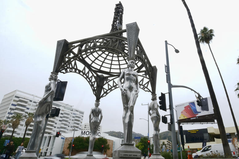 AP19170649806800 Pedestrians walk past the "Four Ladies of Hollywood" gazebo on Hollywood Boulevard in Los Angeles, on Wednesday June 19, 2019. (AP Photo/Richard Vogel)