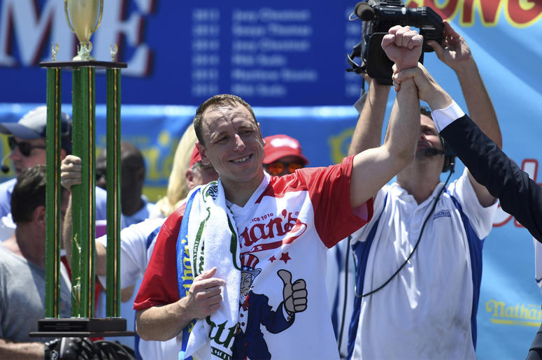 AP19185625926927 Joey Chestnut reacts after winning the men's competition of Nathan's Famous July Fourth hot dog eating contest, Thursday, July 4, 2019, in New York's Coney Island. (AP Photo/Sarah Stier)