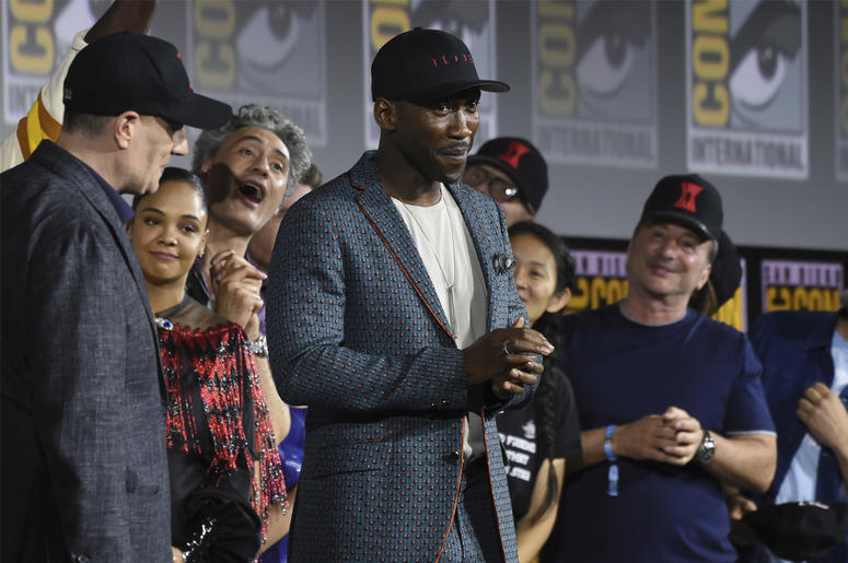 AP19202089253965 Mahershala Ali, center, wears a hat to promote his new movie "Blade" at the Marvel Studios panel on day three of Comic-Con International on Saturday, July 20, 2019, in San Diego. (Photo by Chris Pizzello/Invision/AP)