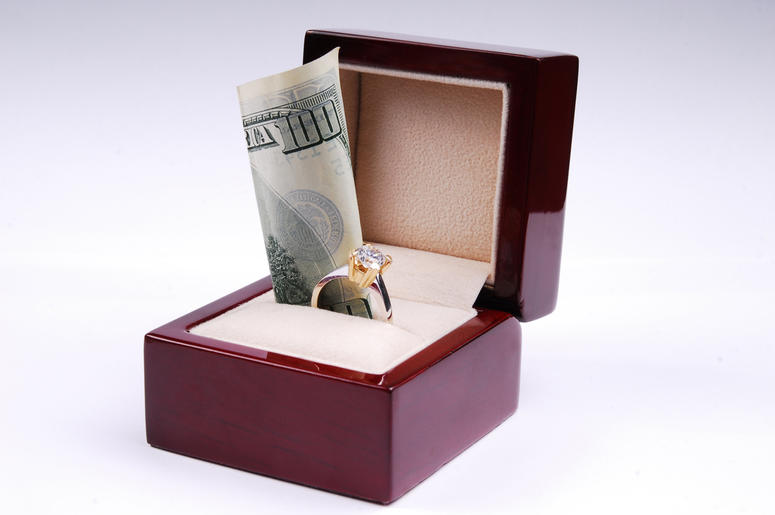 Wedding Ring & Cash Wedding Ring & Cash (Photo credit: Getty Images)