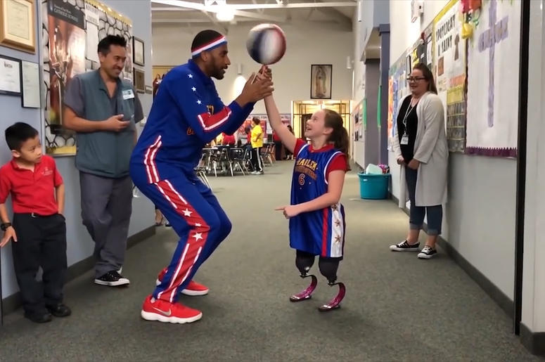 Harlem Globetrotters' Zeus McClurkin and Lilly Biagini Harlem Globetrotters' Zeus McClurkin and Lilly Biagini (Photo credit: Radio.com)