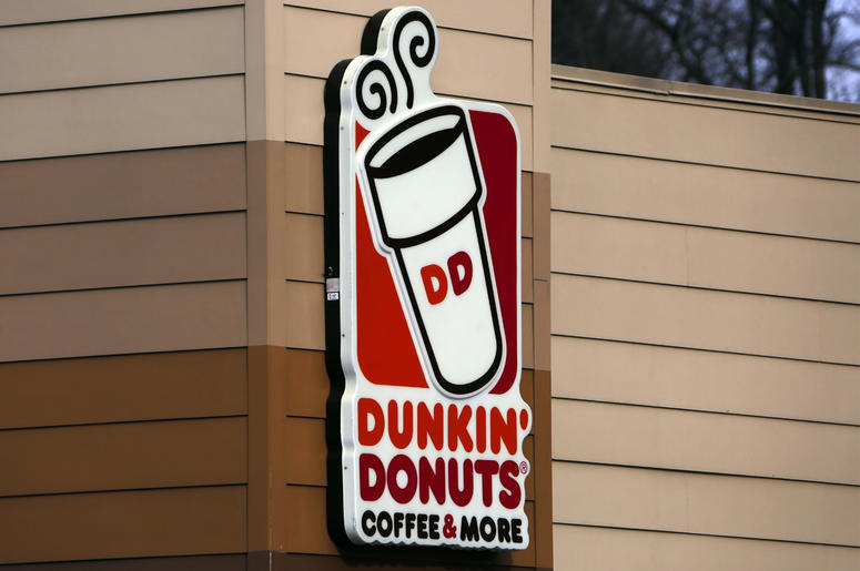d2ed0519579f43ff9eea5cd72fca7079 This Jan. 22, 2018, file photo shows the Dunkin' Donuts logo on a shop in Mount Lebanon, Pa. First, Dunkin’ dropped the “Donuts” from its name. Now, it’s adding espresso drinks to its menu. Dunkin’ says most of its 9,200 U.S. stores will offer lattes, cap