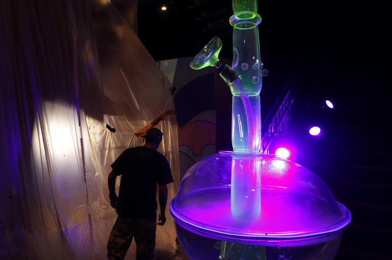 AP18263115535853 In this Tuesday, Sept. 18, 2018 photo, a man walks by a 24-foot-tall bong at the Cannabition cannabis museum in Las Vegas. The museum celebrating all things cannabis with displays that include a glass bong taller than a giraffe and huggable faux marijuana