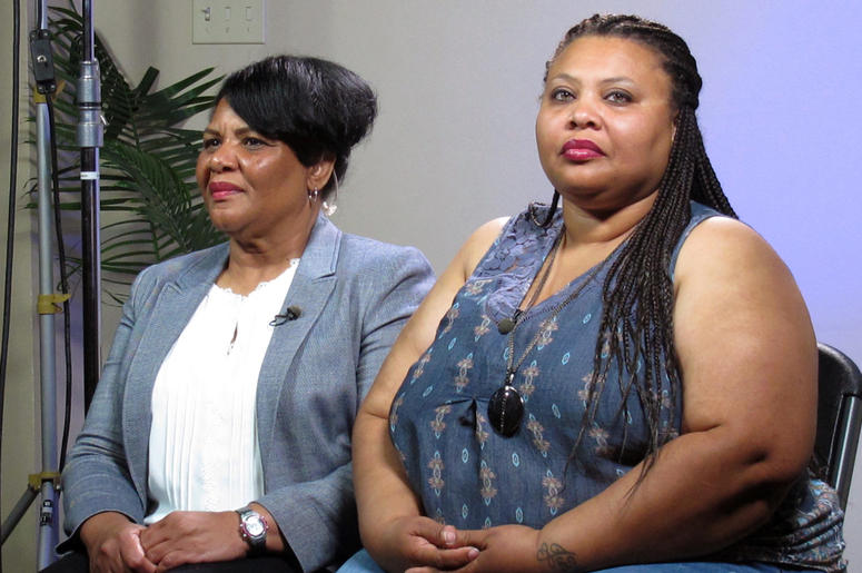 AP19037045863164 In this June 7, 2018 file photo, Alice Marie Johnson, left, and her daughter Katina Marie Scales wait to start a TV interview on in Memphis, Tenn. Johnson, an inmate whose life sentence was commuted thanks in part to the efforts of Kim Kardashian West, no