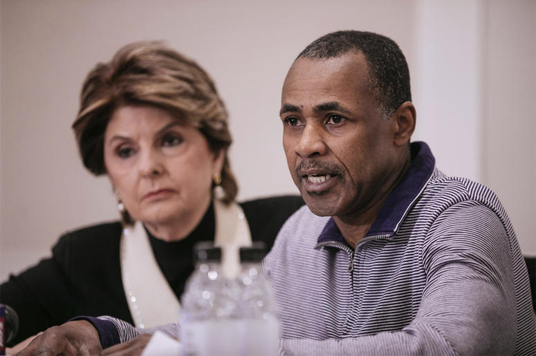 AP19069693473690 Gary Dennis, seated with Lawyer Gloria Allred, speaks during a press conference announcing a video tape said to present further evidence of wrongdoing by recording artist R. Kelly Sunday, March 10, 2019, in New York. (AP Photo/Kevin Hagen)
