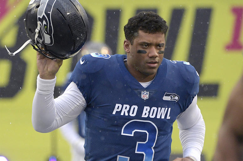 AP19106349787649 In this Jan. 27, 2019, file photo, NFC quarterback Russell Wilson of the Seattle Seahawks runs onto the field during player introductions before the NFL Pro Bowl football game against the AFC in Orlando, Florida. (AP Photo/Phelan M. Ebenhack, File)