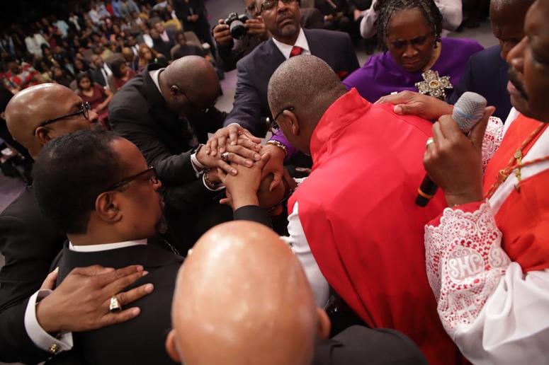 Faith leaders participating in the "Laying of Hands" during the Installation Service for Dr. Jamal Bryant Faith leaders participating in the "Laying of Hands" during the Installation Service for Dr. Jamal Bryant