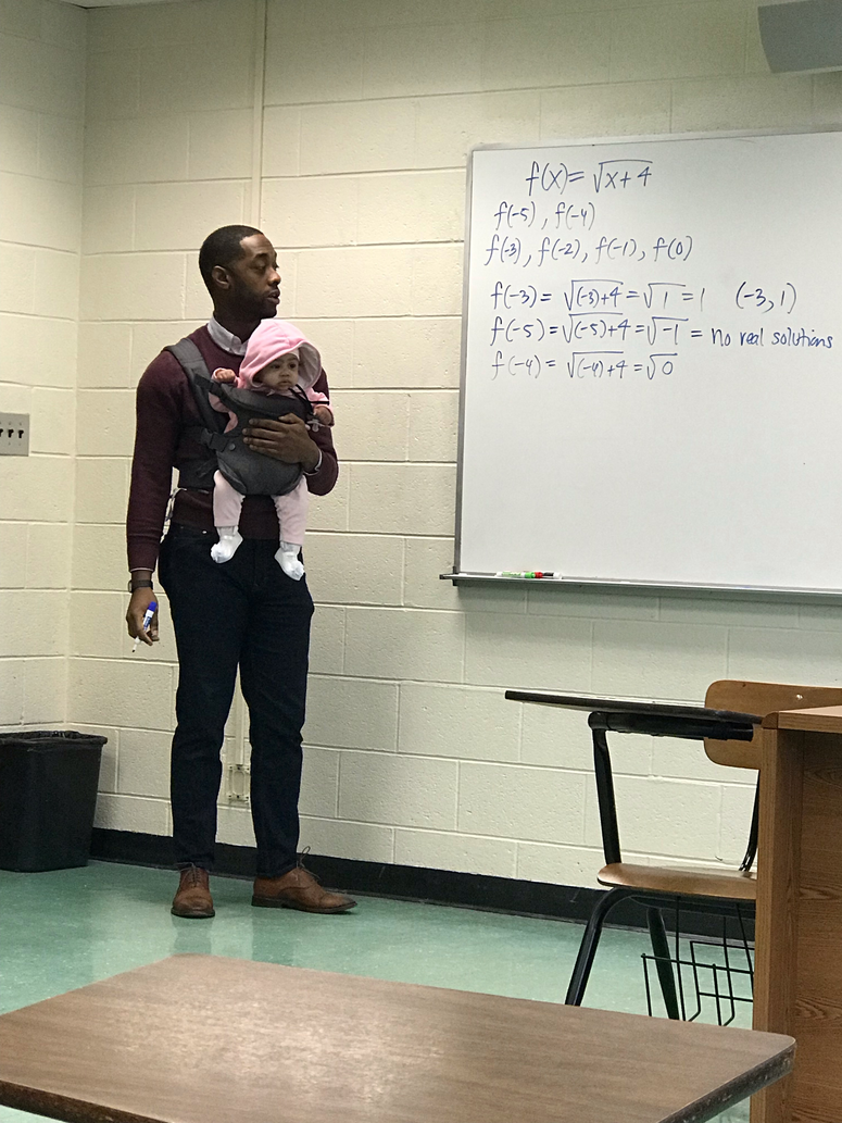 Morehouse visiting professor Nathan Alexander lent a hand to a student who brought his baby to class. Morehouse visiting professor Nathan Alexander lent a hand to a student who brought his baby to class.