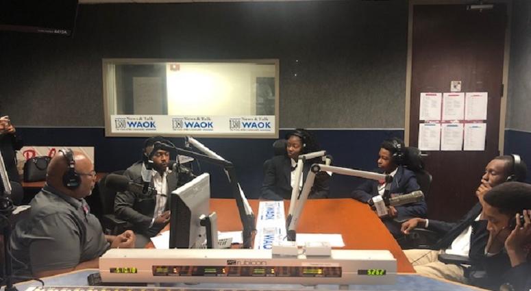 Derrick Boazman with Harvard Diversity Project Debate Team inside the WAOK Studio in Atlanta, Ga 7/17/19 Derrick Boazman with Harvard Diversity Project Debate Team