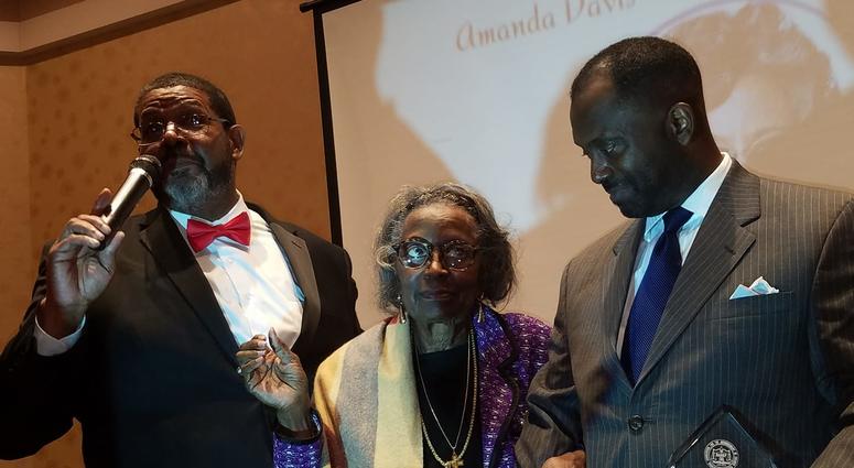 Mrs. Juanita Abernathy is flanked by Fulton County Commissioner Michael Lankford and her son Kwame Abernathy during a recent awards ceremony Mrs. Juanita Abernathy is flanked by Fulton County Commissioner Michael Lankford and her son Kwame Abernathy during a recent awards ceremony