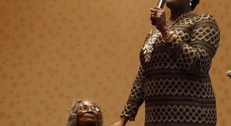 Mrs. Juanita Abernathy is serenaded by Nia Sade' Akinyemi during a recent NAACP awards event Mrs. Juanita Abernathy is serenaded by Nia Sade' Akinyemi during a recent NAACP awards event