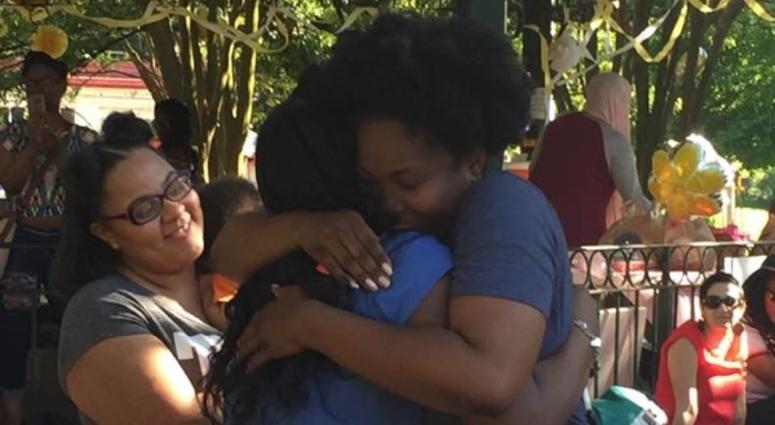 A bailed out mother is welcomed during a Black Mama's Homecoming event