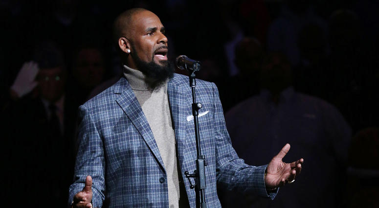 R. Kelly performs the National Anthem prior to the game between the Brooklyn Nets and the Atlanta Hawks at Barclays Center in 2015. R. Kelly performs the National Anthem prior to the game between the Brooklyn Nets and the Atlanta Hawks at Barclays Center in 2015.