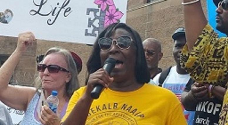 DeKalb NAACP President Teresa Hardy addresses protesters outside the Rockdale County jail