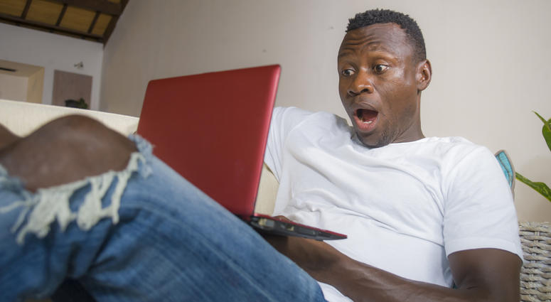 Surprised man at computer Surprised man at computer