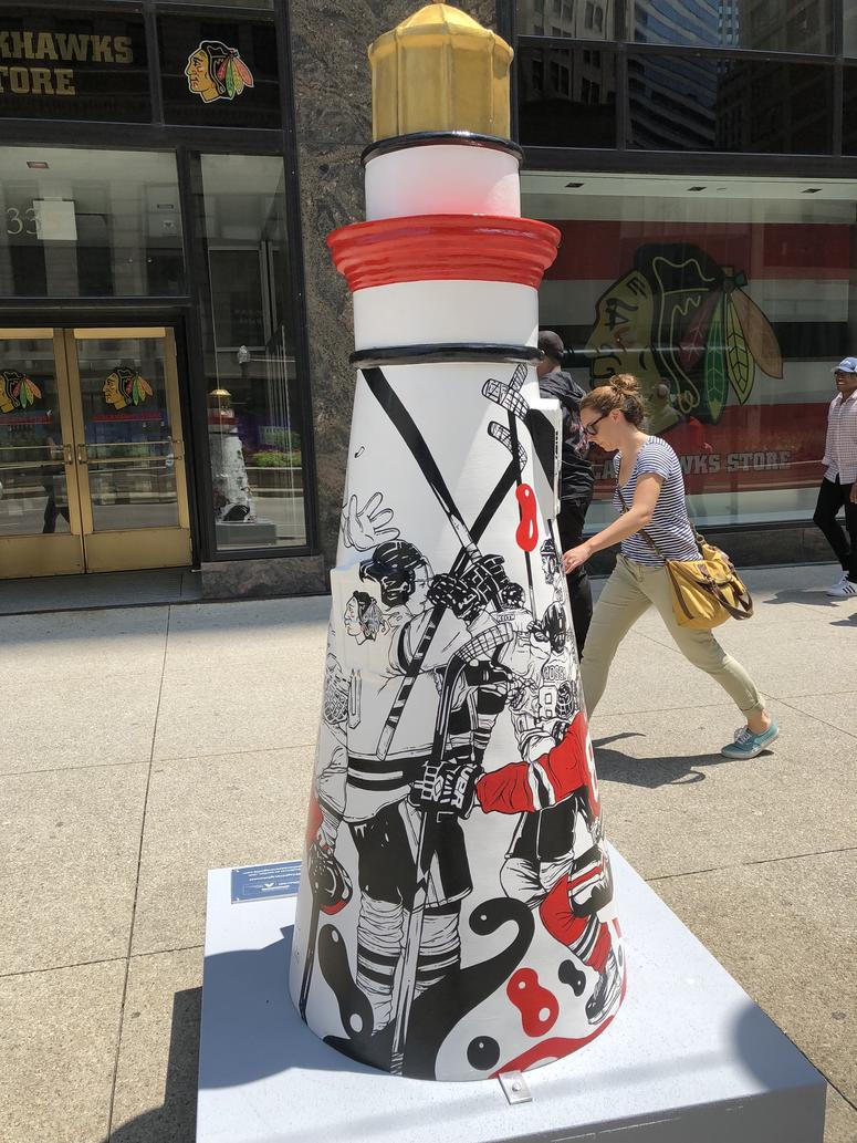 Muhammad's art installation is in front of the Blackhawks store - and it has a Blackhawks theme. The title is "Lift Us."