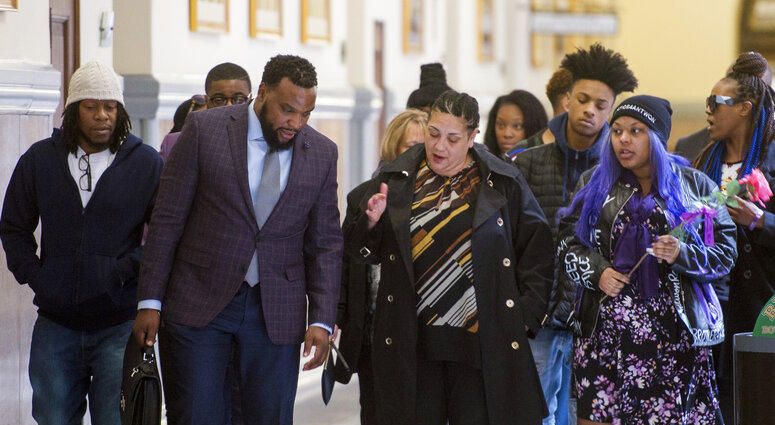 Rose family attorney, S. Lee Merritt, left, and Michelle Kenney, center, mother of Antwon Rose II, walk towards members of the media following the closing arguments.