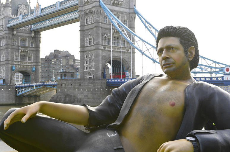 A 25ft statue of actor Jeff Goldblum's in a pose from a scene in the first Jurassic Park movie, which has been created by a TV channel to celebrate the film's 25th birthday, at Potters Fields Park, London, Wednesday July 18, 2018. DO NOT USE