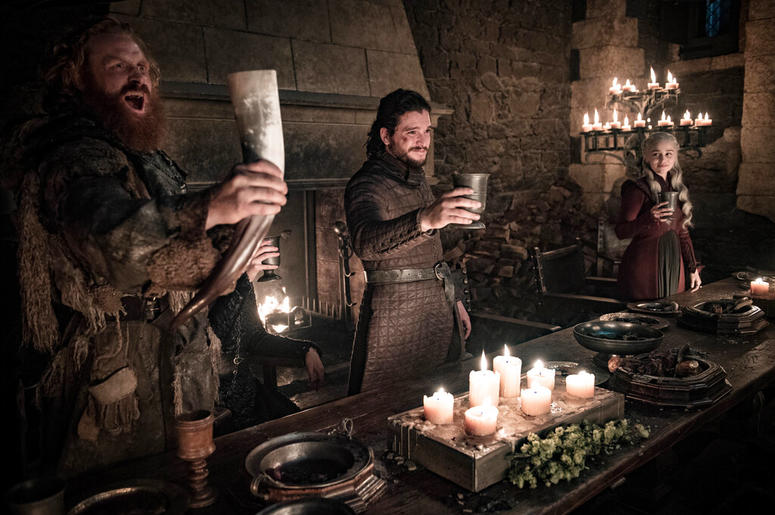 This image released by HBO shows Kristofer Hivju, from left, Kit Harington and Emilia Clarke in a scene from "Game of Thrones." "Game of Thrones," "Veep" and "The Big Bang Theory," three major series that wrapped last season, will find out with Tuesday's