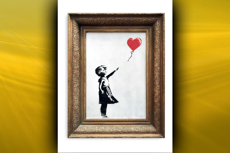 In this undated photo provided by Sotheby's the spray-painted canvas 'Girl with Balloon' by artist Banksy is pictured. DO NOT USE