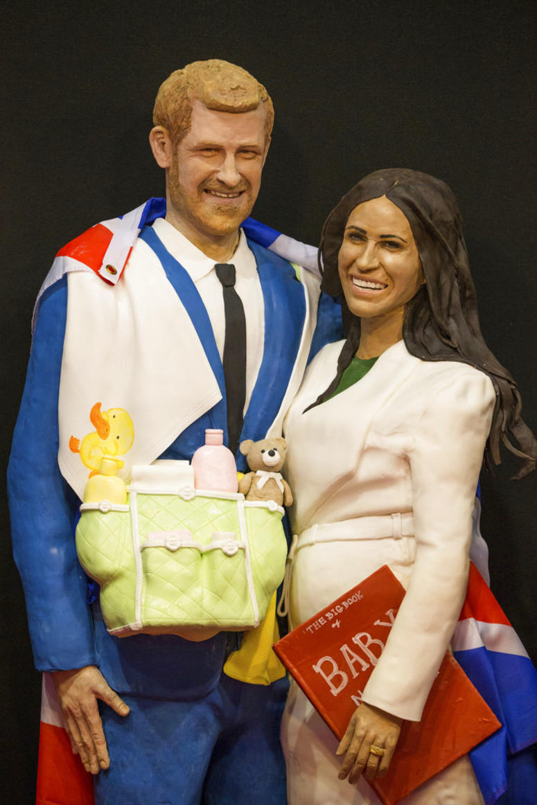 A life-size cake depicting Britain's Prince Harry and Meghan, Duchess of Sussex on display during Cake International, DO NOT USE