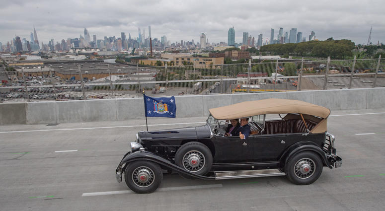 Governor Cuomo announces the opening of the Brooklyn-bound, second span of the Kosciuszko Bridge, the first major bridge crossing built in New York City since the Verrazzano-Narrows Bridge opened to traffic in 1964. Cuomo in FDR's Packard