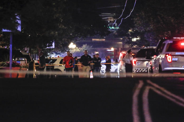 Authorities work the scene of a mass shooting, Sunday, Aug. 4, 2019, in Dayton, Ohio. Dayton shooting