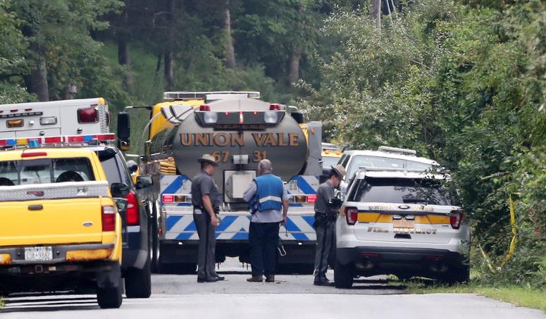 New York State police and FAA representatives continue their investigation at the scene on South Smith Road in Union Vale where a plane crashed into a house on Saturday Aug. 17, 2019. Dutchess crash