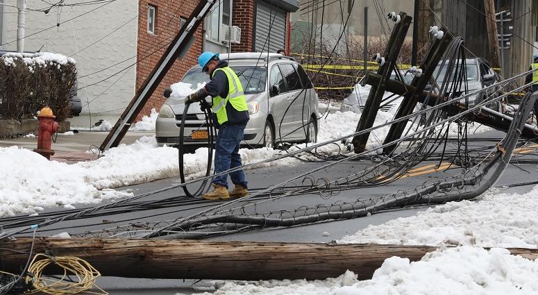 Con Edison workers begin their work after utility poles were knocked over along Lockwood Avenue in Yonkers during the nor'easter. Con Edison Crews after nor'easter