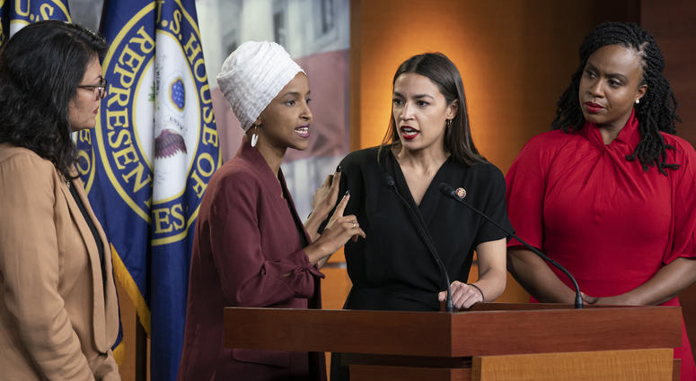 From left, Rep. Rashida Tlaib, D-Mich., Rep. Ilhan Omar, D-Minn., Rep. Alexandria Ocasio-Cortez, D-N.Y., and Rep. Ayanna Pressley, D-Mass., respond to remarks by President Donald Trump during a news conference in Washington, Monday, July 15, 2019. Dems 'The Squad'