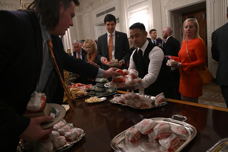 Guests attending a reception for the Clemson Tigers grab fast food sandwiches in the State Dining Room of the White House in Washington, Monday, Jan. 14, 2019. Trump McDonalds
