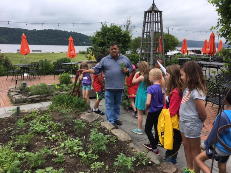 Harvest on Hudson owner Angelo Liberatore gives some kids from Hillside Elementary School a tasting tour. Angelo Liberatore