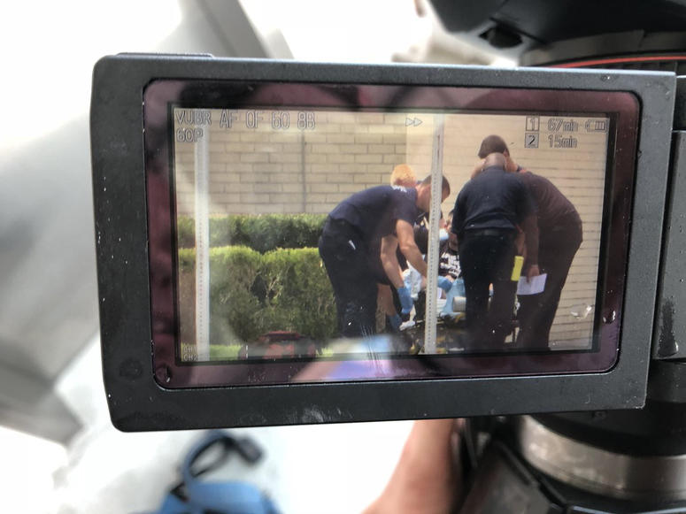 JFRD treating a gunshot victim outside Jacksonville Landing. Florida mass shooting