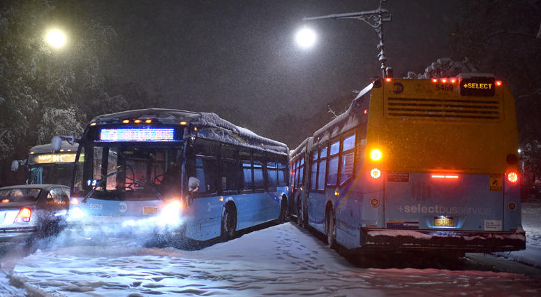 Two articulated MTA buses sit without passengers along 81st Street and Central Park West as on of them crashed into the side of the other after loosing traction during first snowfall of the season to blanket New York City on November 15, 2018. MTA Bus Crash