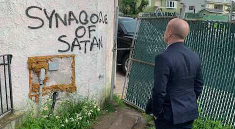 Congressman Max Rose inspects anti-Semitic graffiti at the Chabad of Staten Island Chabad of Staten Island