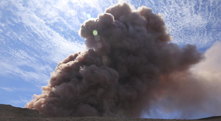 In this photo released by U.S. Geological Survey, a plume of ash rises from the Puu Oo vent on Hawaii's Kilaueaa Volcano after a magnitude 5.0 earthquake, Thursday, May 3, 2018 in Hawaii Volcanoes National Park. Hawaii's Kilaueaa Volcano