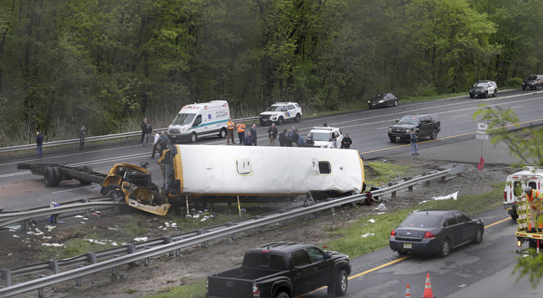 Emergency personnel work at the scene of a school bus and dump truck collision, injuring multiple people, on Interstate 80 in Mount Olive, N.J., Thursday, May 17, 2018. Deadly New Jersey School Bus Crash