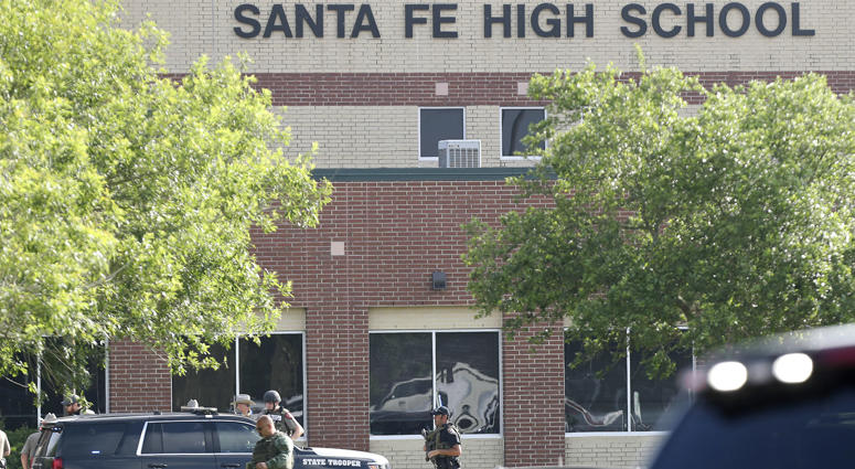Law enforcement officers respond to Santa Fe High School after an active shooter was reported on campus, Friday, May 18, 2018, in Santa Fe, Texas. Texas High School Shooting