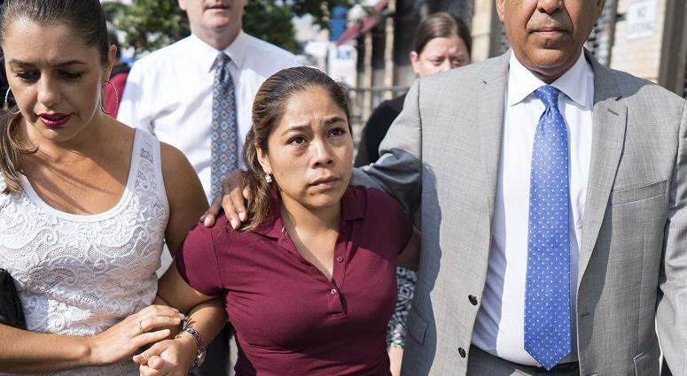 Yeni Gonzalez, center, a Guatemalan mother who was separated from her three children at the U.S.-Mexico border arrives Tuesday, July 3, 2108 to reunite with them in New York. Yeni Gonzalez
