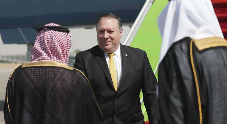 U.S. Secretary of State Mike Pompeo, centre, is greeted by Saudi Foreign Minister Adel al-Jubeir, after arriving in Riyadh, Saudi Arabia, Tuesday Oct. 16, 2018. Mike Pompeo in Saudi Arabia