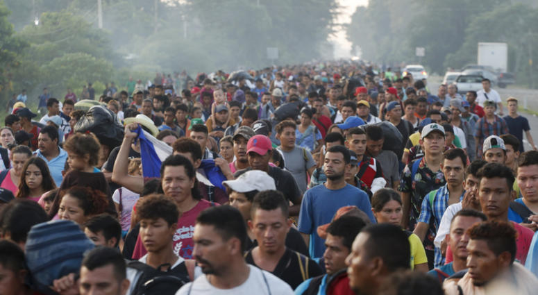Central American migrants walking to the U.S. start their day departing Ciudad Hidalgo, Mexico, Sunday, Oct. 21, 2018. Immigrant Caravan