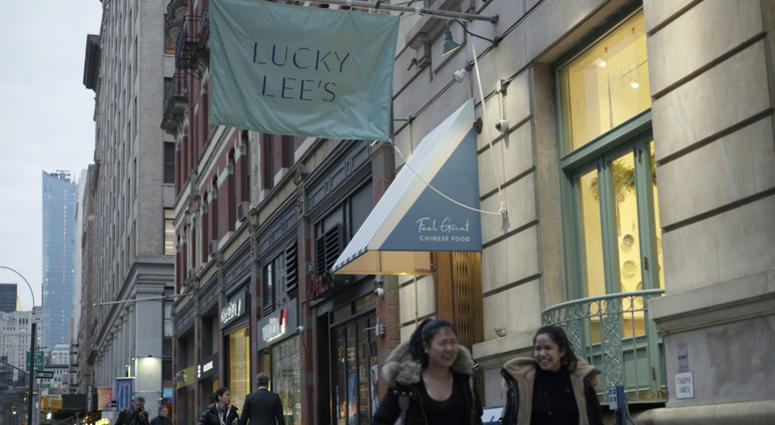 Pedestrians walk past the Lucky Lee's restaurant in the Greenwich Village on April 11, 2019 Lucky Lee's