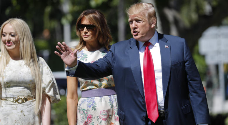 President Donald Trump, right, with first lady Melania Trump, center, and daughter Tiffany Trump, left, arrive for Easter services at Episcopal Church of Bethesda-by-the-Sea, Sunday, April 21, 2019, in Palm Beach, Fla. President Donald Trump Easter