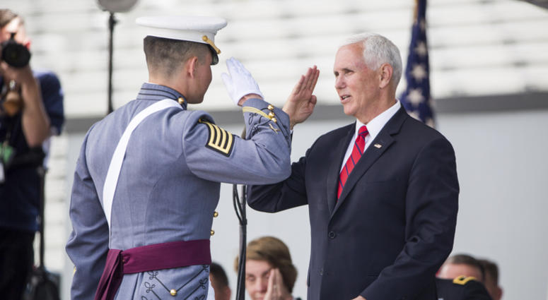 Vice President Mike Pence salutes a graduating cadet before handing him his diploma during graduation ceremonies at the United States Military Academy, Saturday, May 25, 2019, in West Point, N.Y. Mike Pence West Point