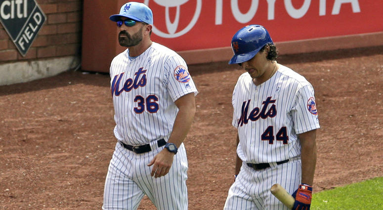 New York Mets' Jason Vargas, right, is accompanied by manager Mickey Callaway as he leaves a baseball game during the fourth inning against the St. Louis Cardinals at Citi Field, Sunday, June 16, 2019, in New York. Callaway and Vargas