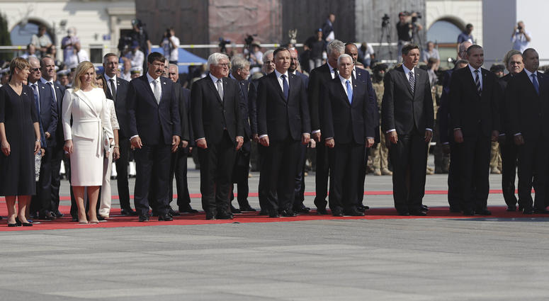 Officials and leaders, among them U.S. Vice President Mike Pence, Polish President Andrzej Duda, and German President Frank-Walter Steinmeier stand during a memorial ceremony marking the 80th anniversary of the start of World War II in Warsaw, Poland, Sun World War II anniversary
