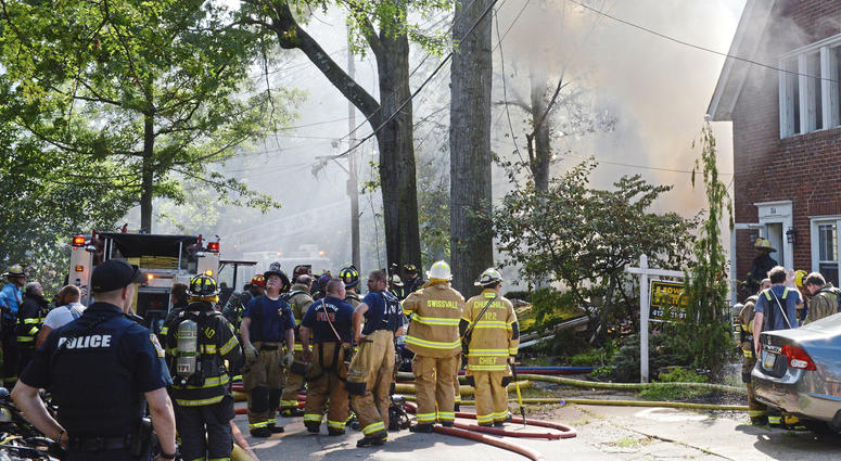 First responders work at the scene of a house fire on Garland Street in Edgewood, Pa., on Saturday, Sept. 14, 2019. Pennsylvania house explosion